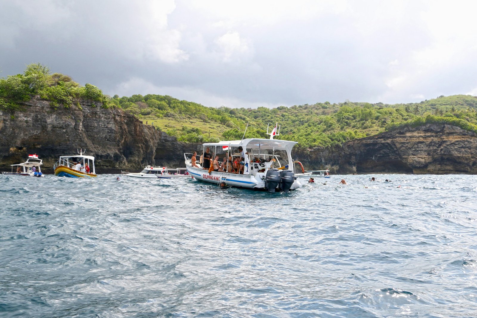 a group of people on a boat in the water