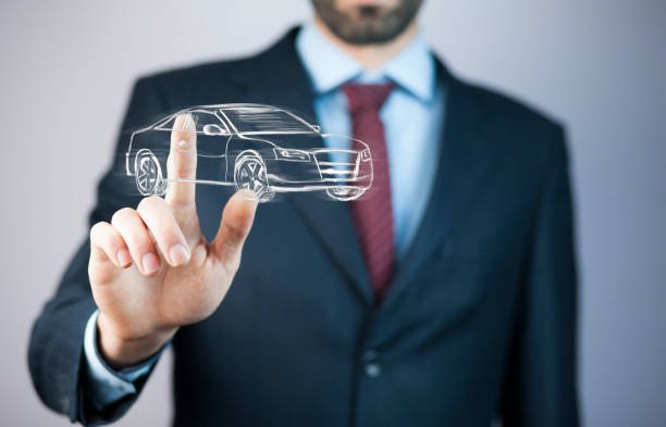 a man in a suit pointing at a car insurance